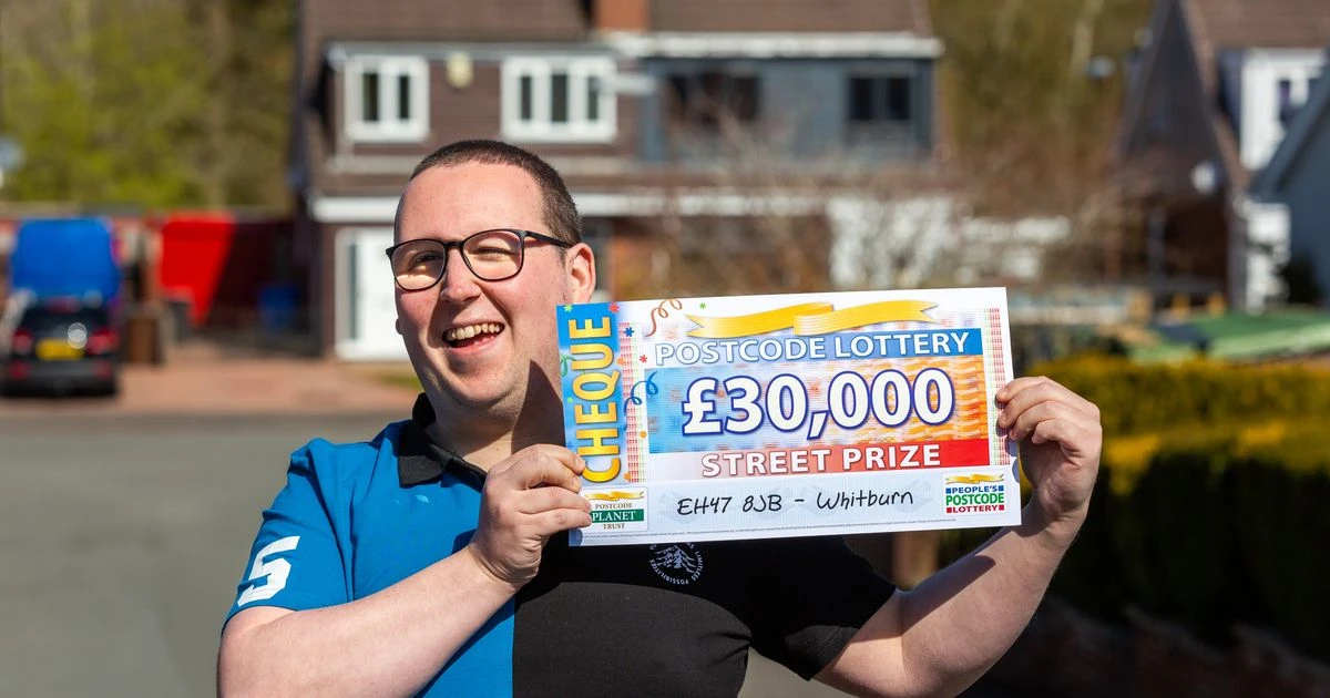 Lottery winner left speechless when cheque is unveiled