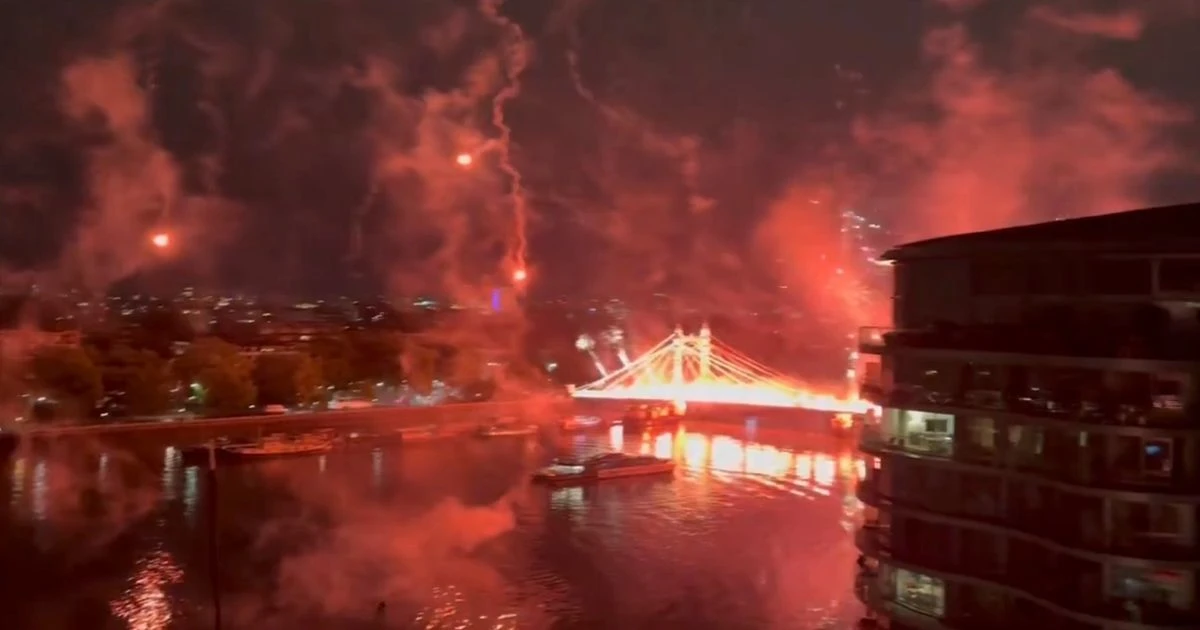 London's Albert Bridge lit up with fireworks and flares as one lands on Uber boat in dangerous scenes