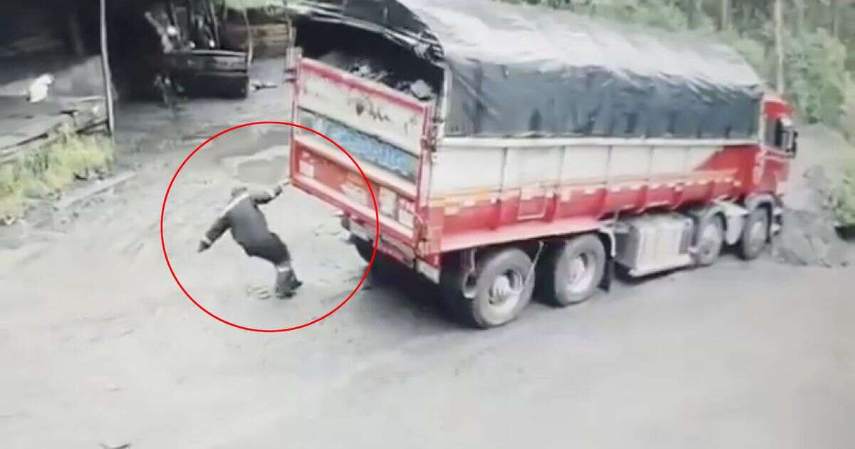 Bizarre moment super strong driver drags truck out of quagmire with one hand