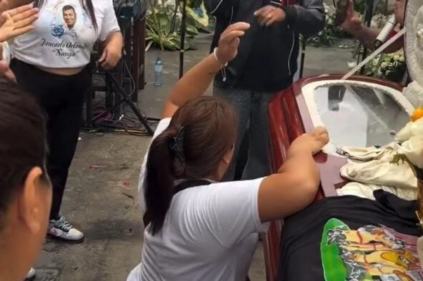 Crying widow twerks and shakes bum on husband’s coffin in bizarre send-off
