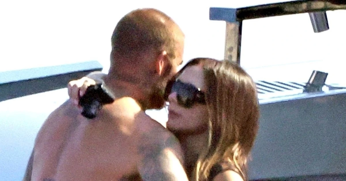 David Beckham grabs Victoria's bum on family yacht break as Nicola Peltz makes dig