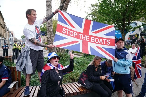 Russia to track all migrants and 'demand DNA' while UK hotel fury grows