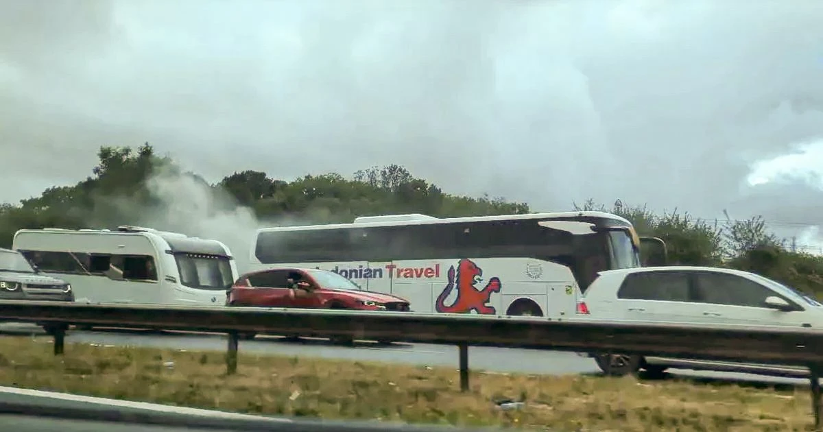 LiveM5 LIVE: Huge traffic delays as dozens evacuated after coach fire