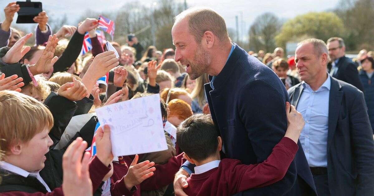 Prince William jokes about breaking world record as he's mobbed by schoolkids