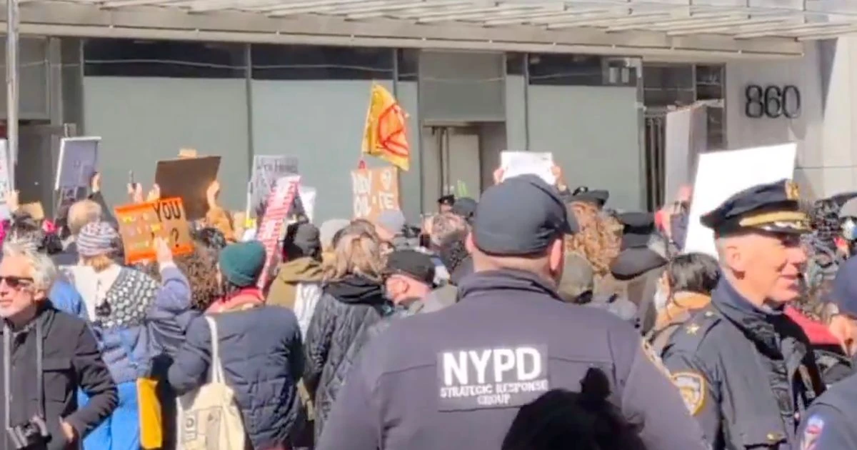 Elon Musk protestors clash with cops in chaotic scenes after occupying Tesla showroom