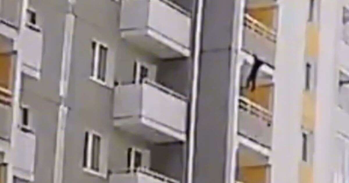 Heart stopping moment home alone boy, 5, dangles from fifth floor balcony