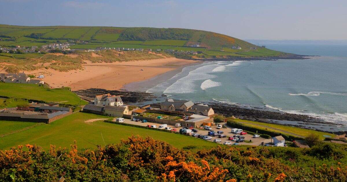 Small UK seaside town with golden sands and late night ice cream parlour