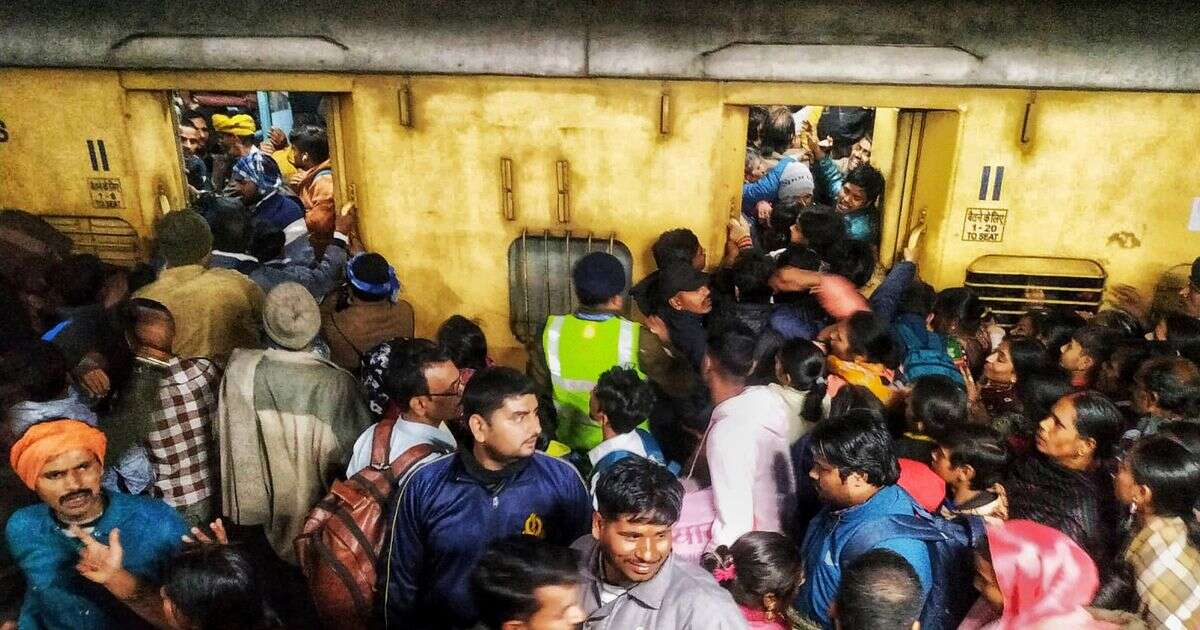 New Delhi stampede kills at least 15 cramming onto trains for world's largest religious festival