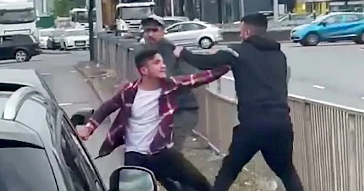 Two men batter driver in broad daylight road rage attack before woman steps in to help