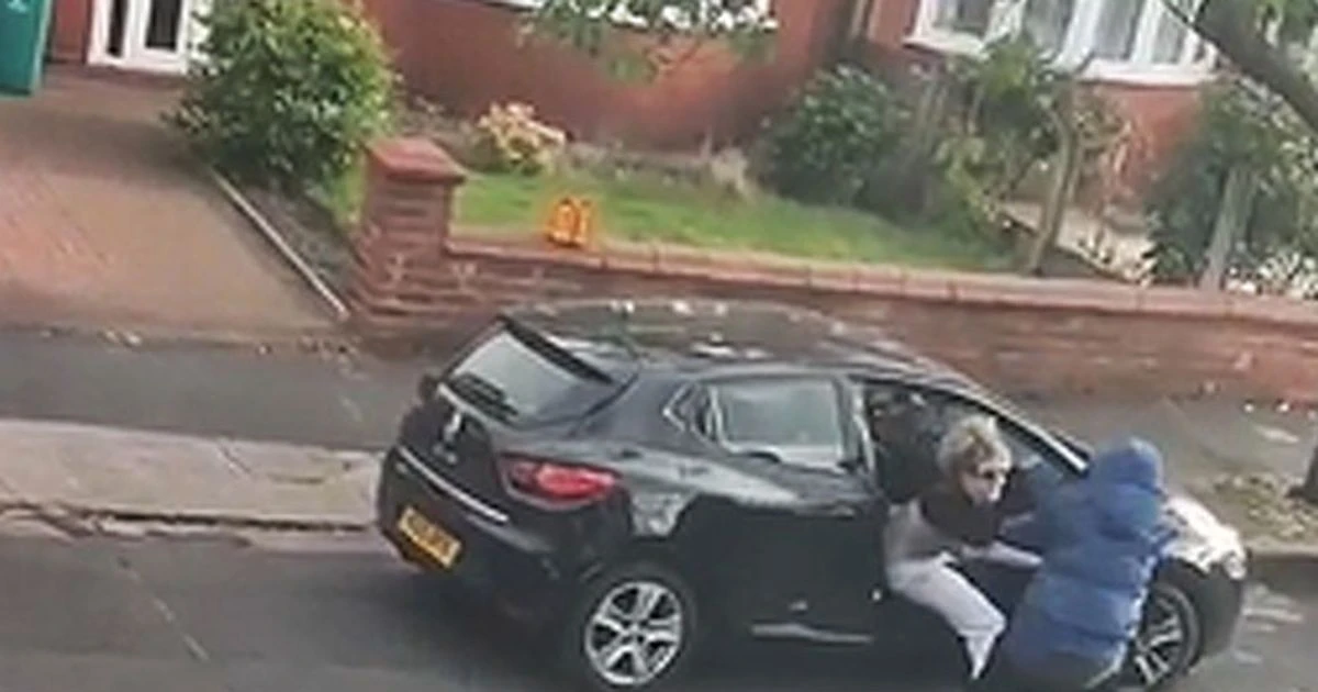 Moment mum scrambles to save her tot, 2, as thugs steal car in knifepoint ambush
