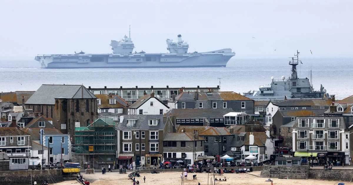 Mind-bending photos show Royal Navy warship 'flying' through air above sea