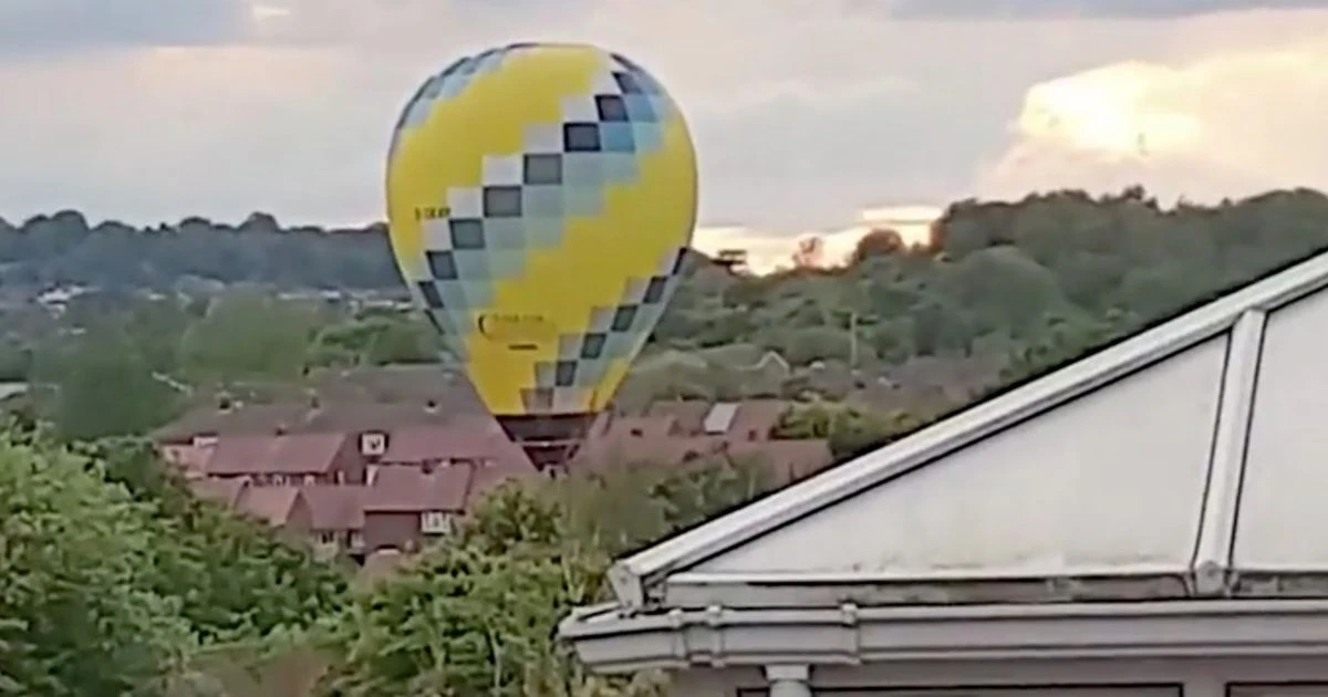 Incredible moment hot air balloon accidentally lands in a housing estate