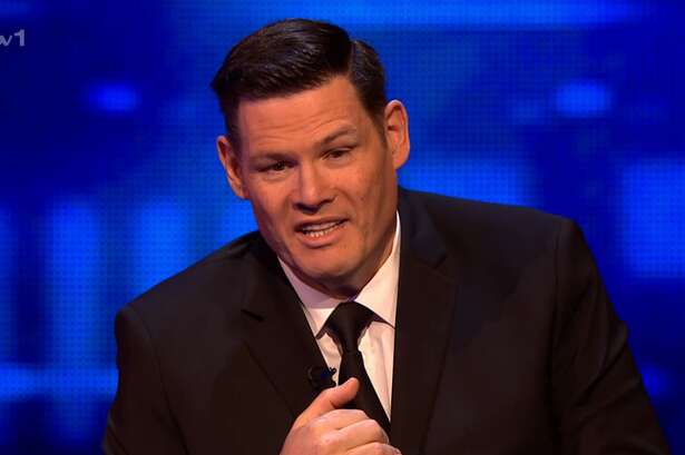 The Chase's Mark Labbett poses with brunette and jokes about 'flashing knickers' months after split