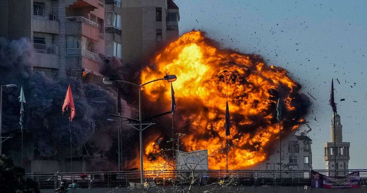 Moment Israeli rocket slams into Beirut tower block in massive fireball explosion