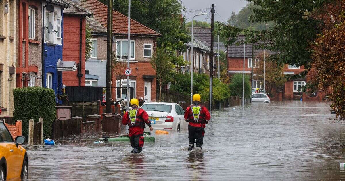 Flood warnings across UK as roads swamped by water and travel delays hit Britain