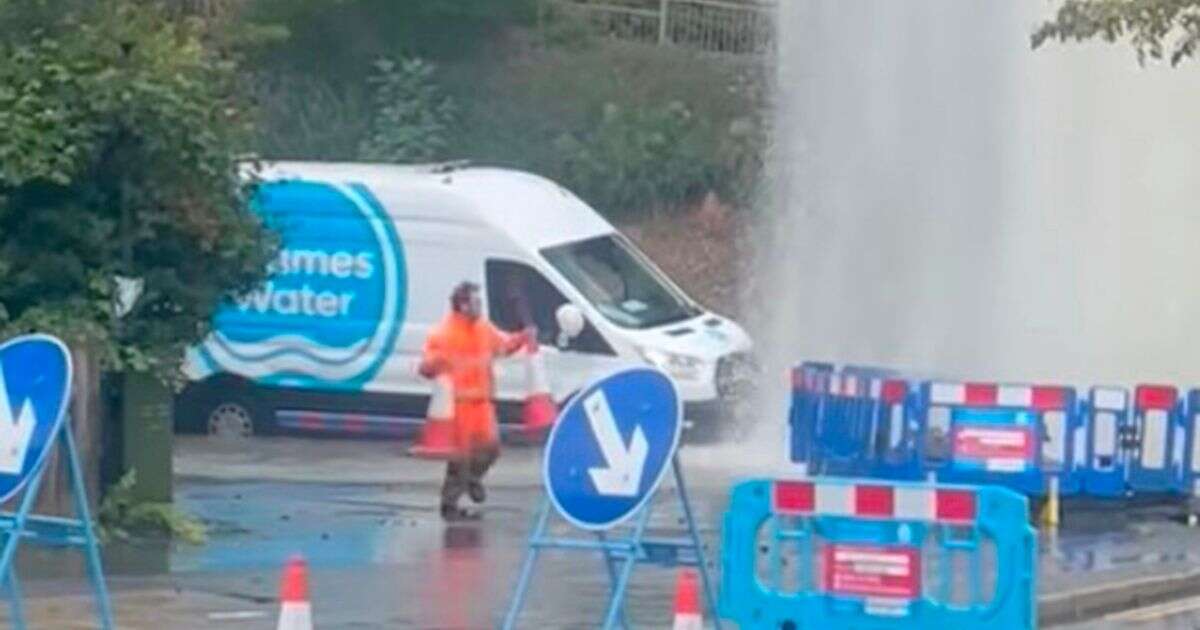 Thames Water employee desperately puts cones round 30ft jet of water from burst mainThames Water PLC