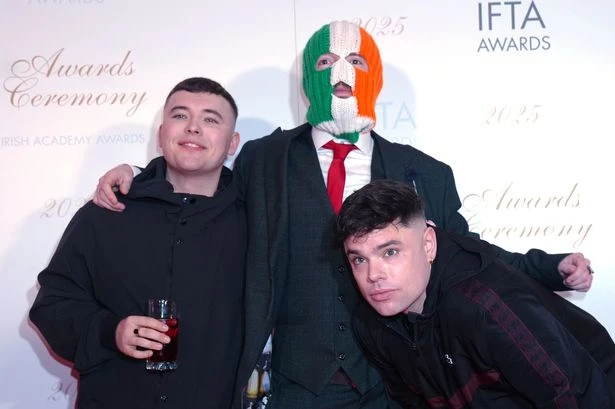 Kneecap's surprise gig stormed by police hours after star charged with terror offence