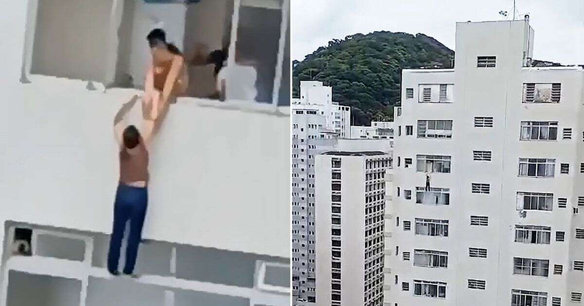 Terrifying moment woman hangs from skyscraper after slipping while cleaning window