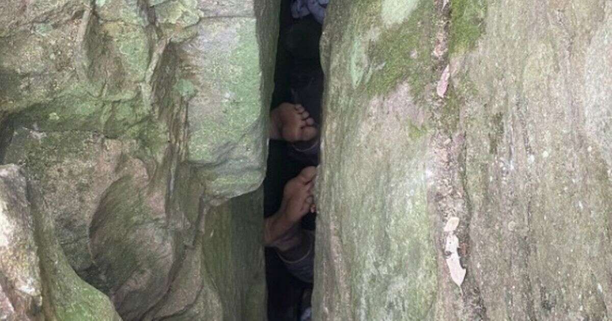 Woman trapped upside down for seven hours after falling into rock crevice