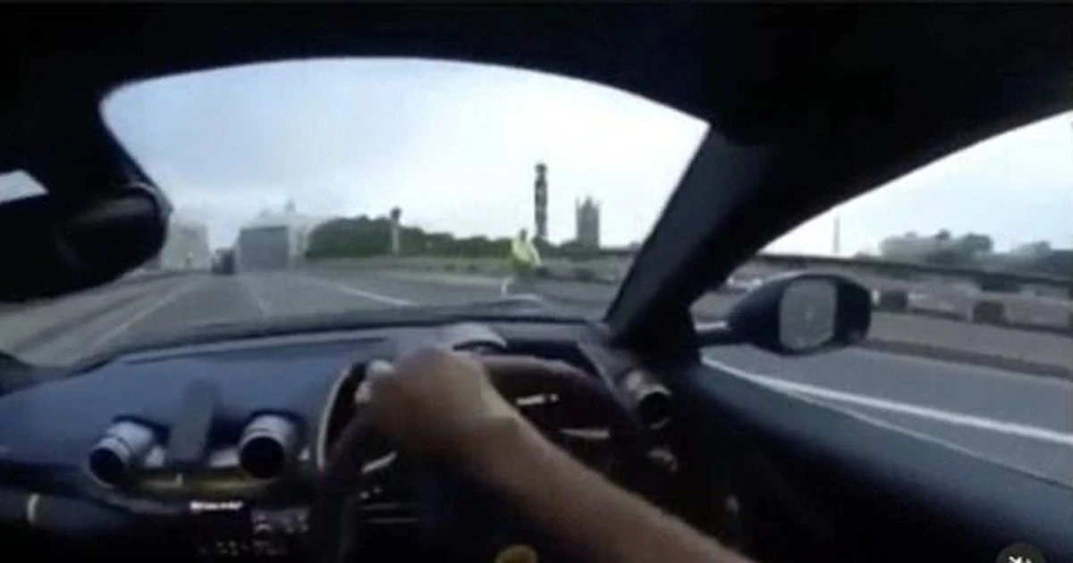 Moment Ferrari crashes on London's Lambeth Bridge - narrowly missing cyclists