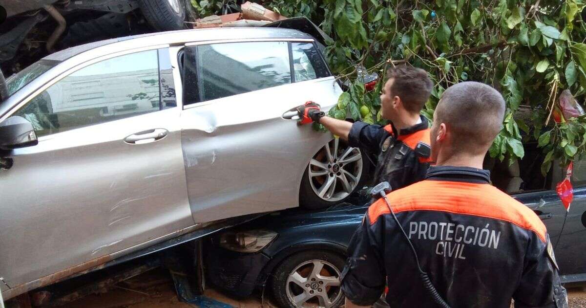 Woman found alive trapped in car beside body of sister three days after floods devastated Valencia