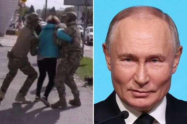 Putin's forces arrest woman in broad daylight for 'spying for the enemy' as locals watch on