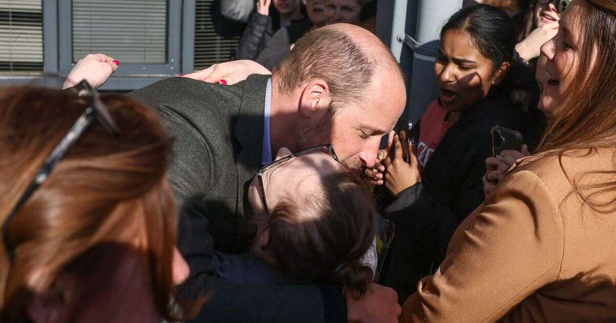 Prince William hugs starstruck fan as he's mobbed by screaming students