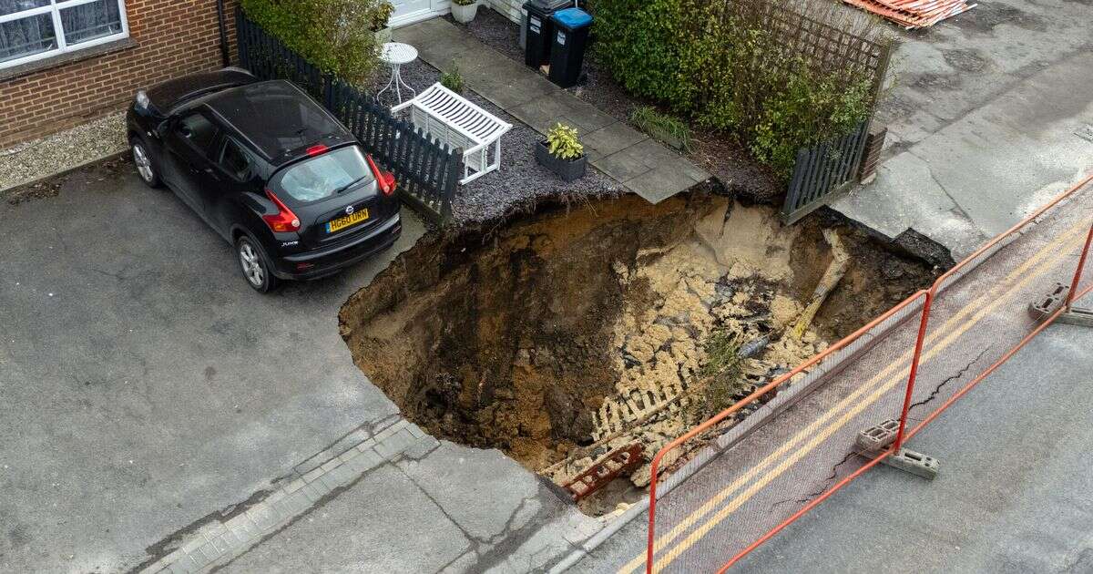 '65ft Godstone sinkhole is swallowing our street but we won't leave - we are not afraid'