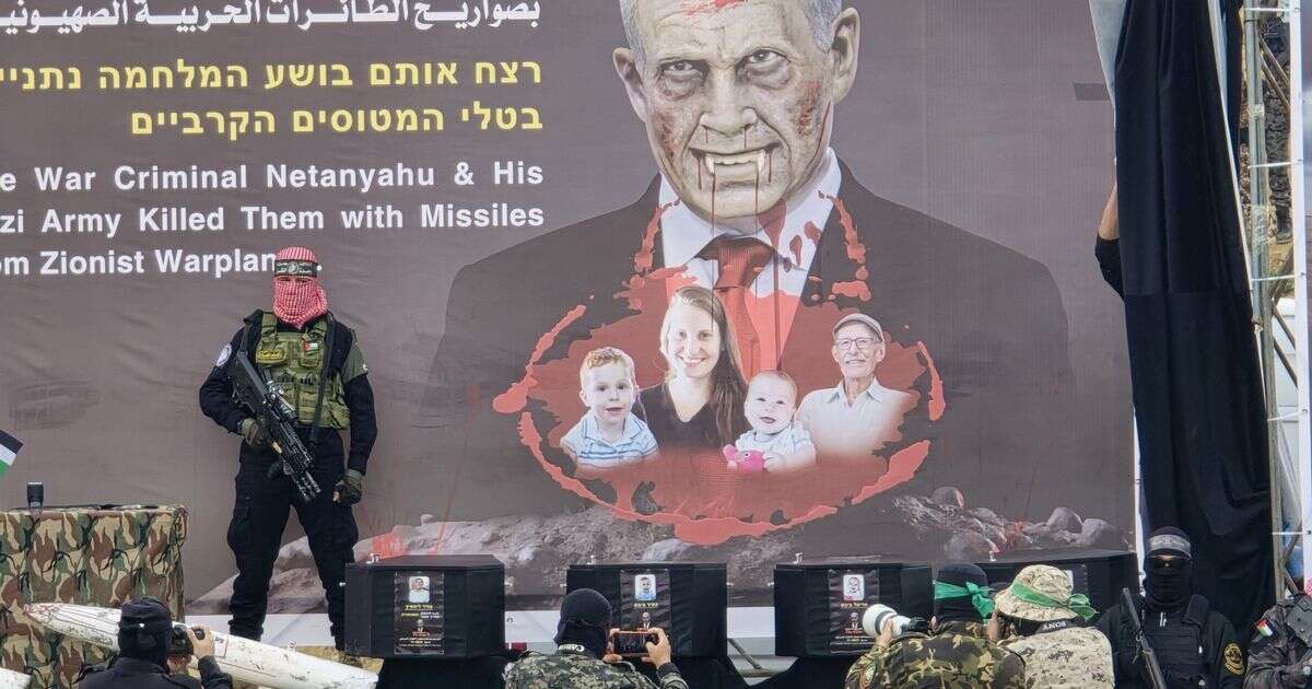 Sickening moment armed Hamas soldiers stand over coffins of dead children in latest Gaza exchange