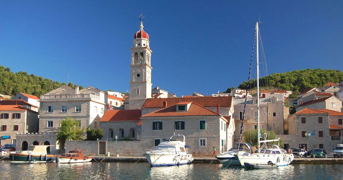 Budget town in sunny European county with fairytale homes made of marble