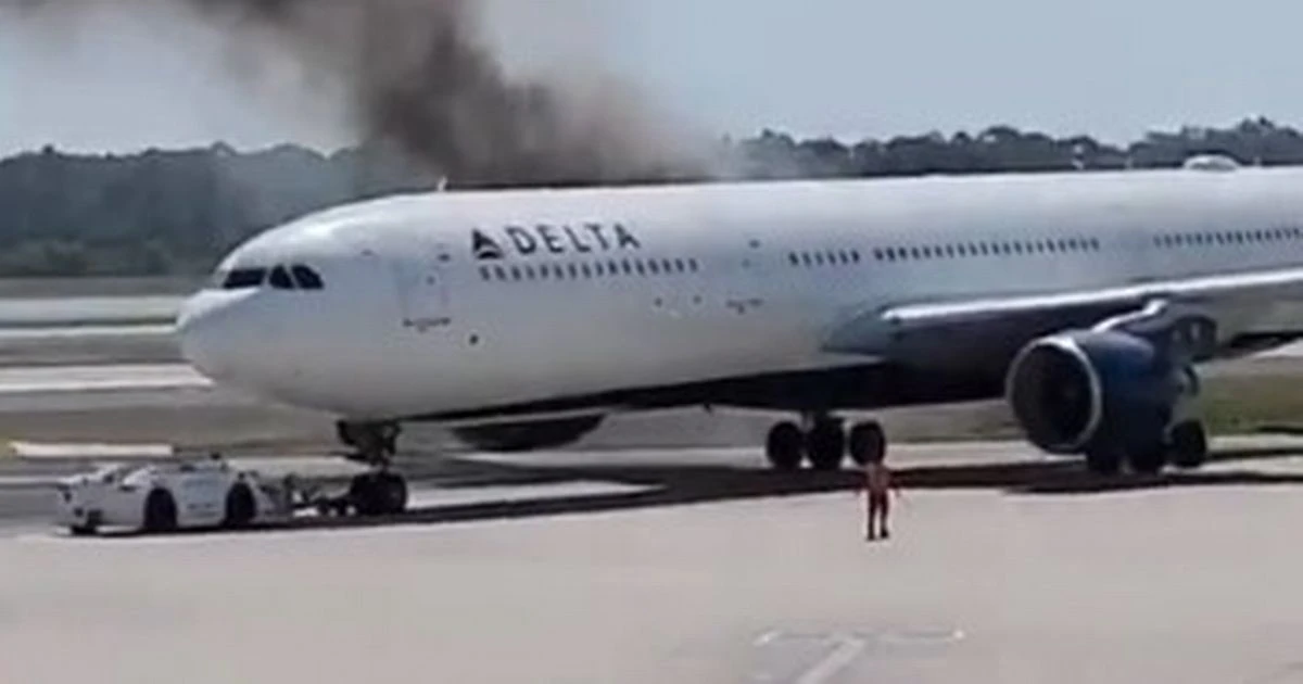 Delta Air Lines flight emergency as Orlando airport plane ON FIRE with passengers evacuated
