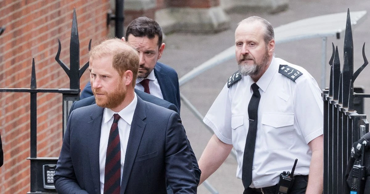 Prince Harry escorted out of court by burly bodyguards after outburst by woman
