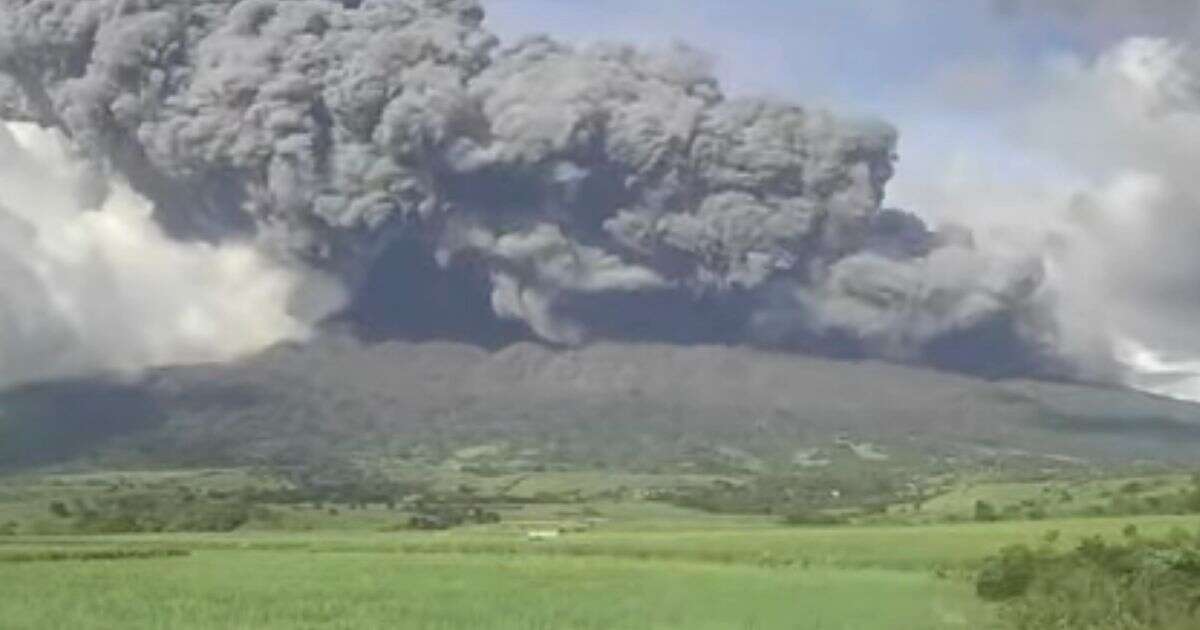 Philippines volcano eruption sends ash plume two miles into the air as locals flee homes