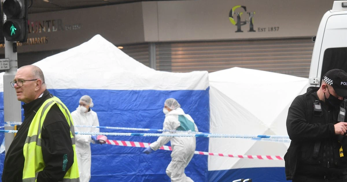 Young man stabbed to death outside shopping centre with boy held over 'murder'
