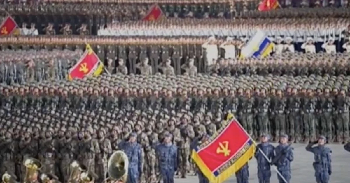 Kim Jong-un claims no North Koreans have Covid-19 as he unveils new missiles at parade