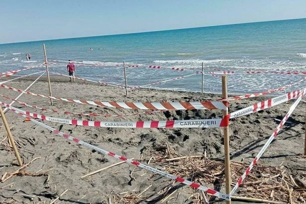 Dad's horror as teen son 'buried alive' and suffocated to death on beach