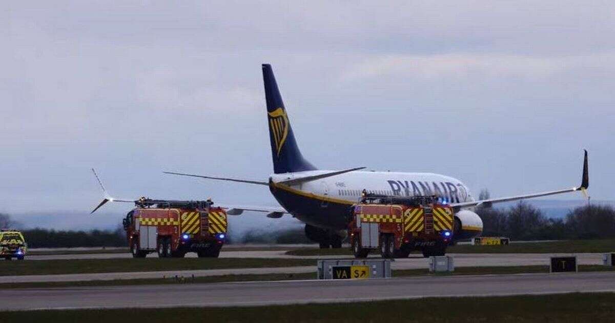 Ryanair plane surrounded by fire engines at Manchester Airport after forced emergency landing