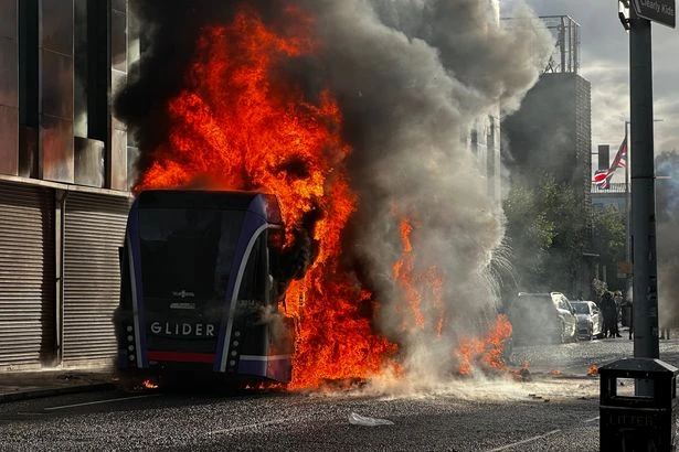 Tensions rise in Belfast as protestors set bus on fire following brutal knife attack