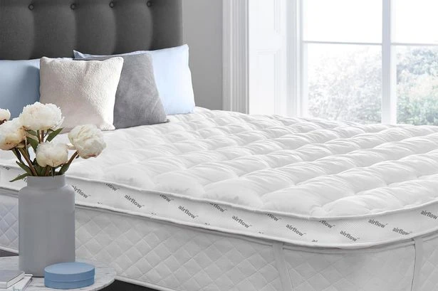 I spotted a 'thick' mattress topper that shoppers say is like 'sleeping on a cloud'