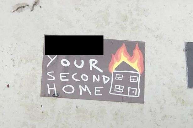 Stickers posted suggesting second homes will be set on fire