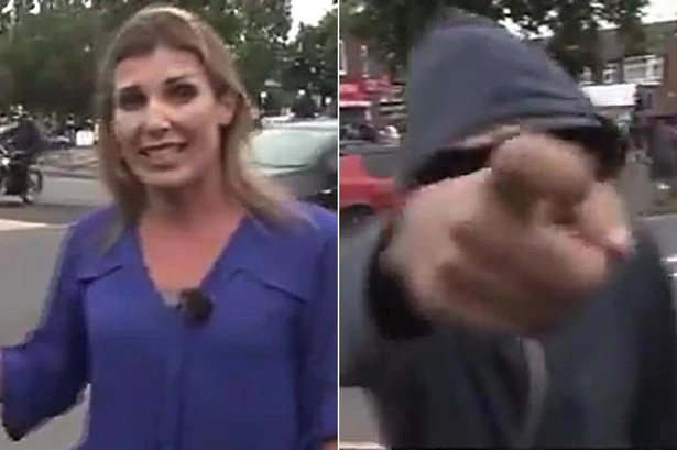 Sky News reporter forced off-air as masked mob make foul-mouthed rant on live TV
