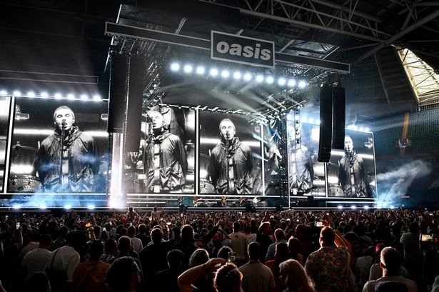 Oasis' Cardiff show in chaos as emergency sees fan stretchered from crowd