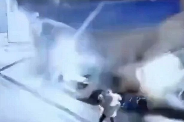 Dad and daughter pair trapped as car wash collapses on them in shocking video