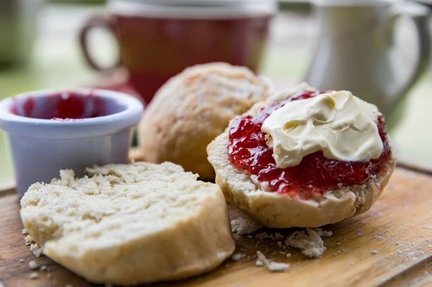Prince William and Meghan Markle's methods slammed as Brits have their say on eating scones