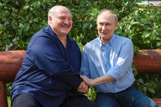 Putin's bromance with fellow war-mongerer exposed as pair pose for bizarre bench images