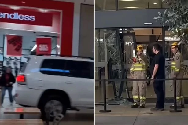 Car drives through major shopping centre as terrified shoppers forced to hide