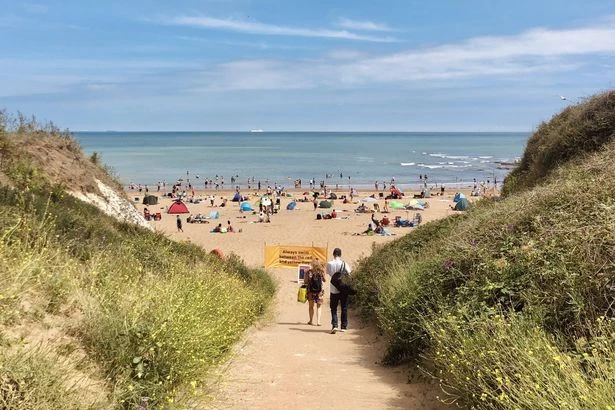 Naked bloke seen 'performing lewd act' while 'doing laps' of nudist beach
