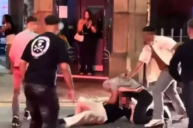 Mass brawl breaks out in Manchester city centre after man slammed onto bonnet
