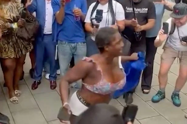 P Diddy supporter strips off and dances in baby oil in bizarre scenes outside court