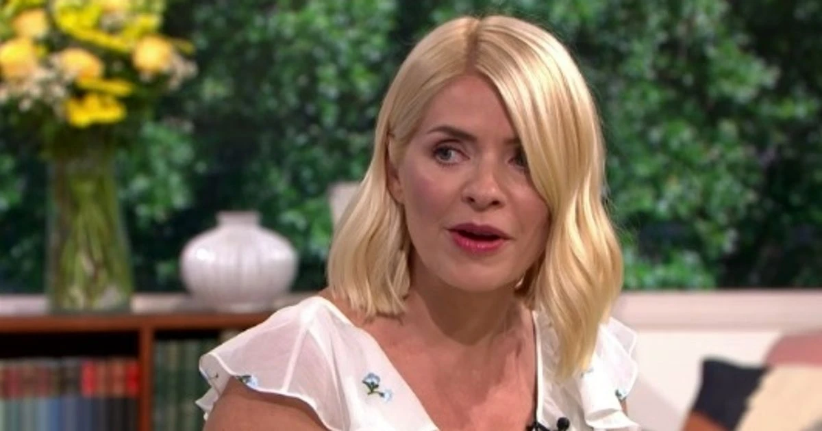 Terrified Holly Willoughby squeals as Phillip Schofield teases her with creepy doll